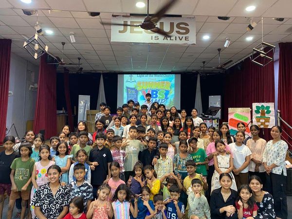 The whole holiday Bible club together in the hall