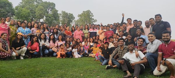 The whole group on the grass at a church outing