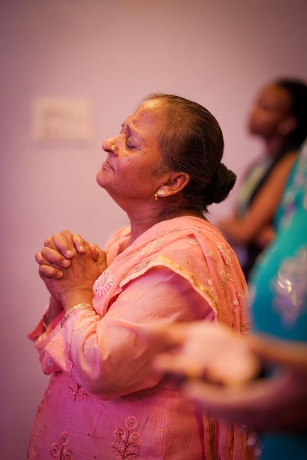 A woman praying with her face lifted