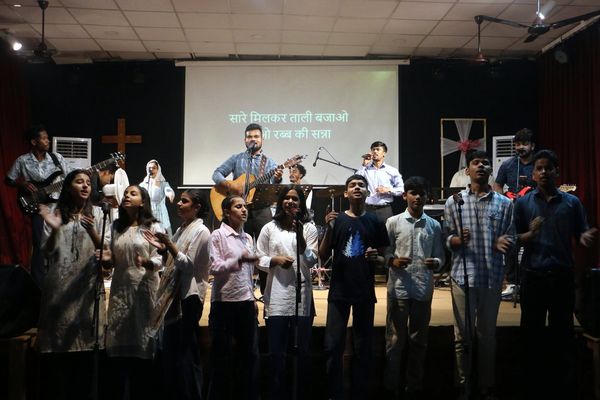 The teenagers leading the singing on a Sunday