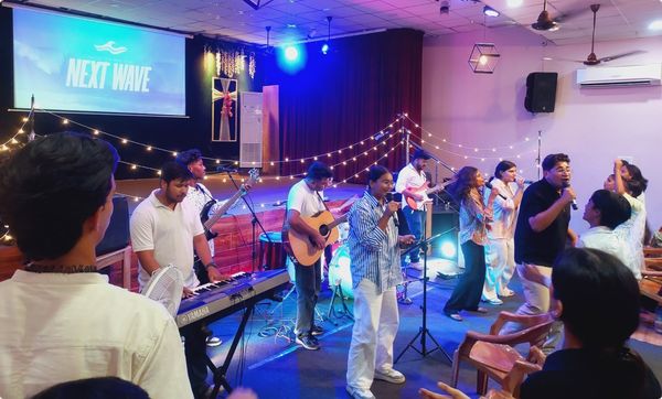 Young people worshipping at a youth night